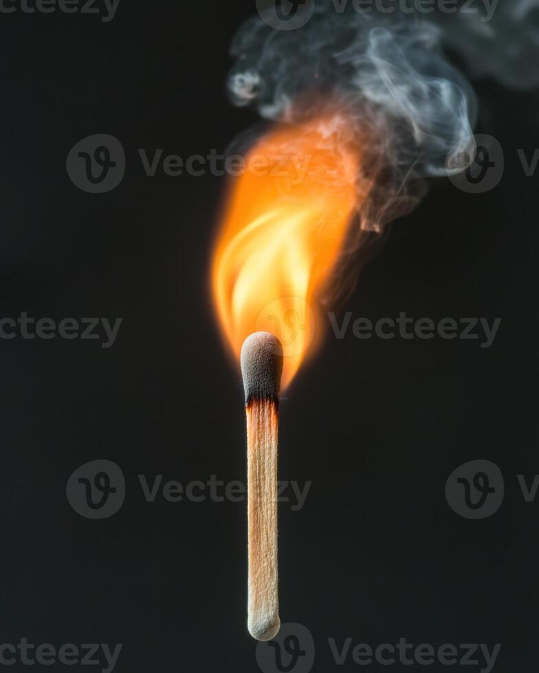 Burning match with smoke photo
