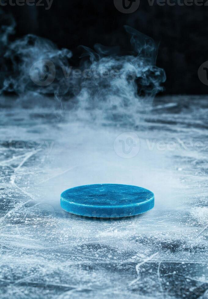 Frozen hockey puck on ice with steam photo