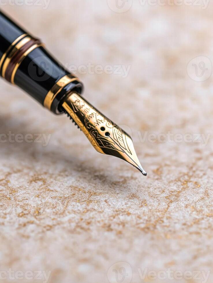 Close up of an ornate fountain pen on a textured surface photo