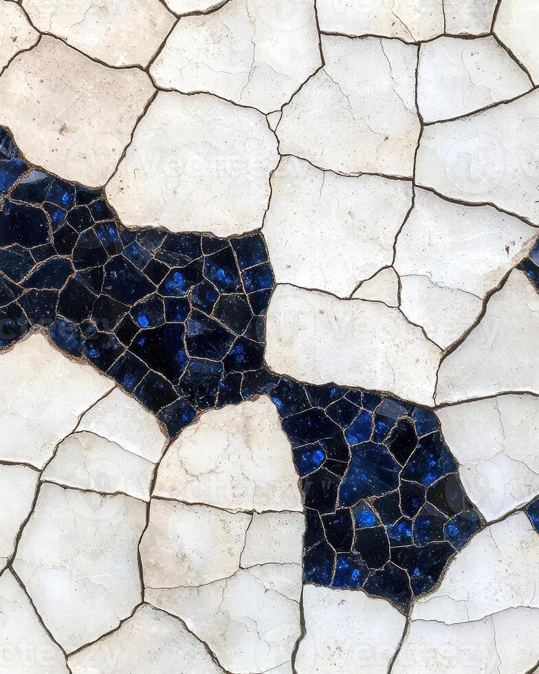 Cracked marble texture with blue gemstone accents photo