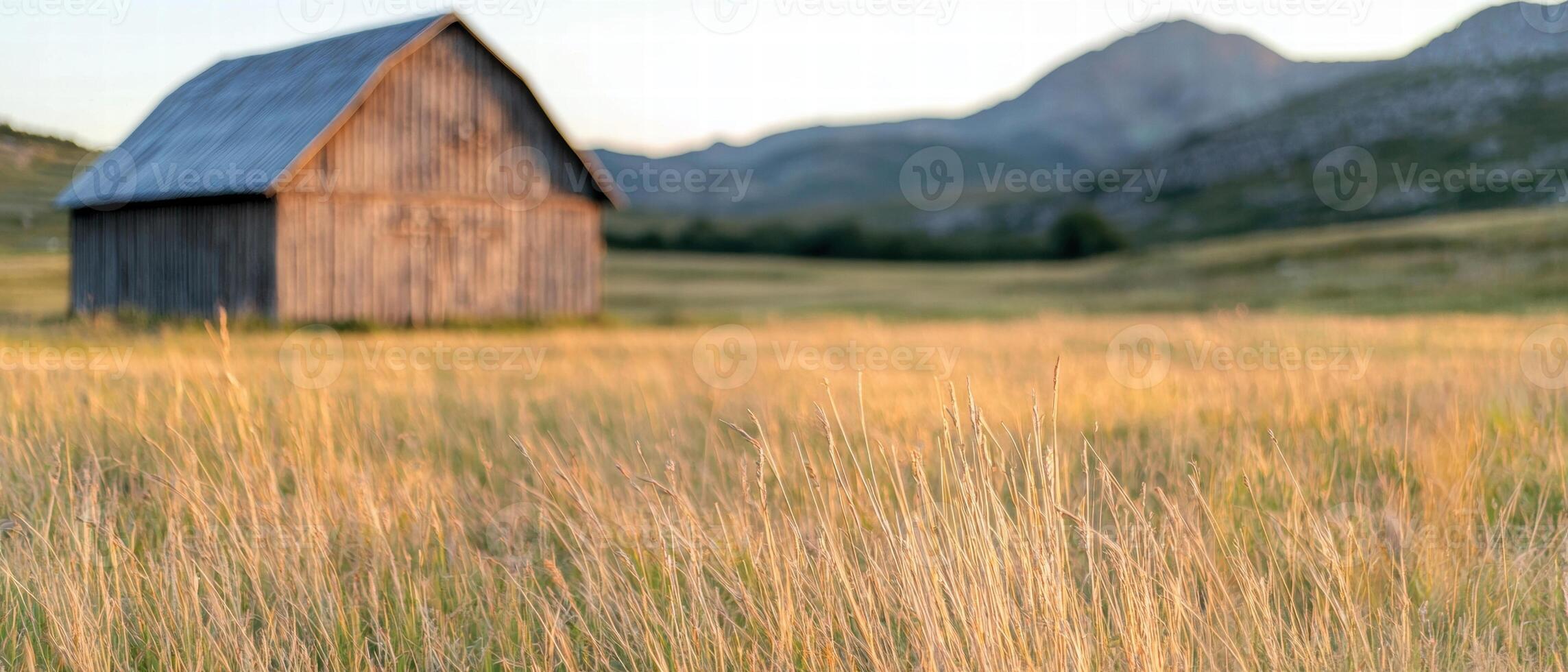 Rustic barn in scenic mountain landscape photo