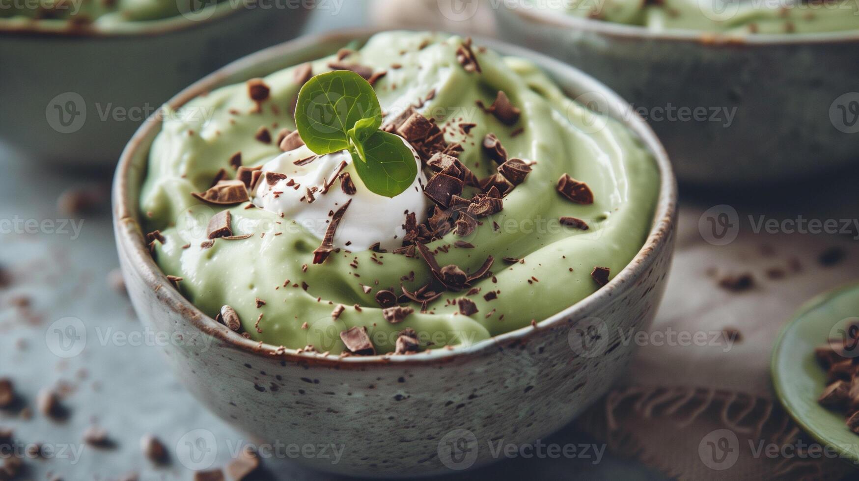 Bowl of creamy sugar-free avocado mousse topped with coconut cream and cocoa nibs, photography photo