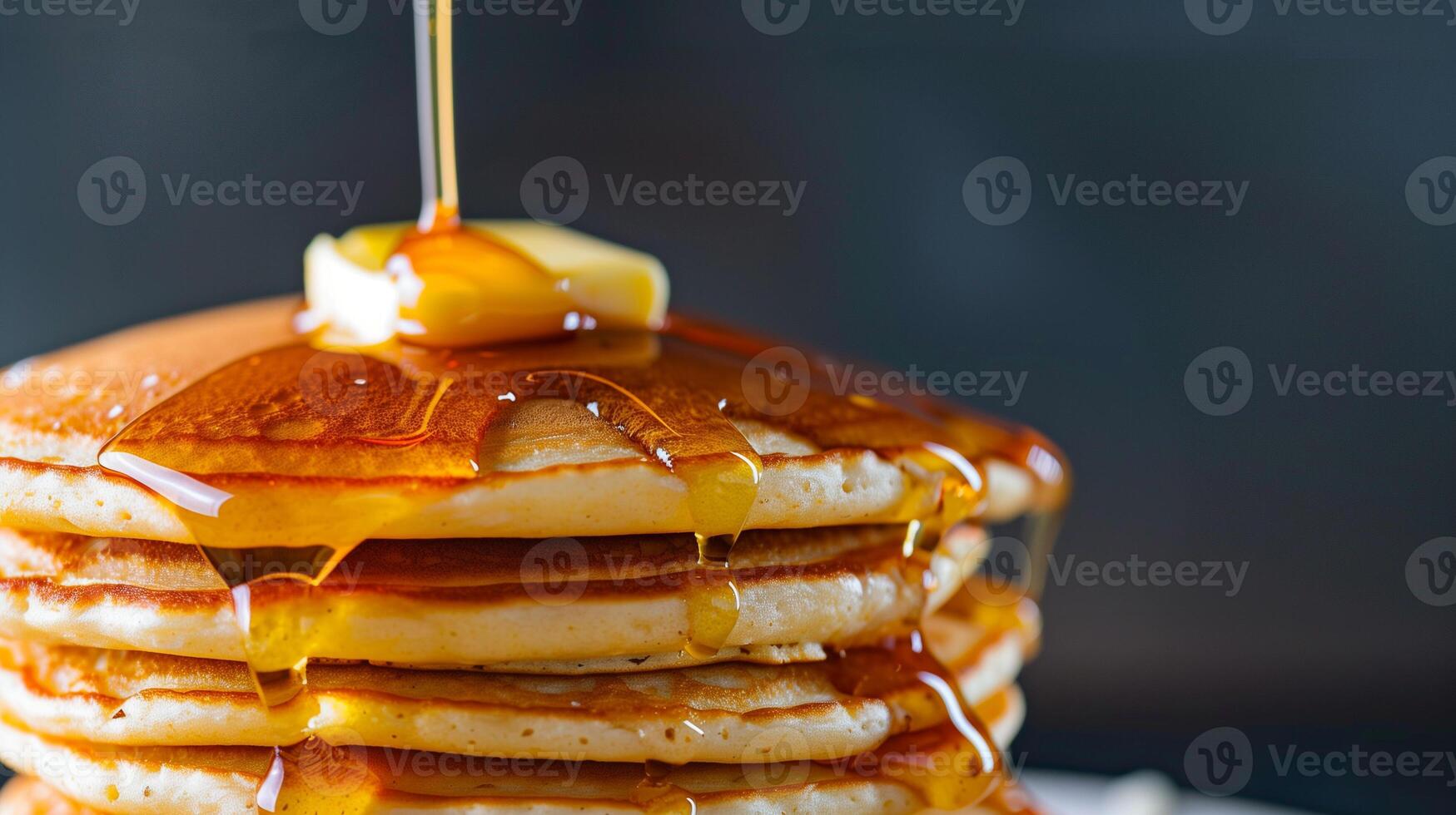 A close-up of a stack of golden brown pancakes dripping with maple syrup and topped with a pat of melting butter, photorealistic photo