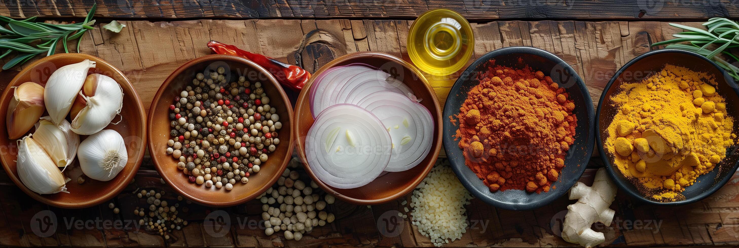 High-definition image of wooden kitchen table with ingredients including onions, fresh ginger, garlic, red chili powder, turmeric powder, top down view, photography photo