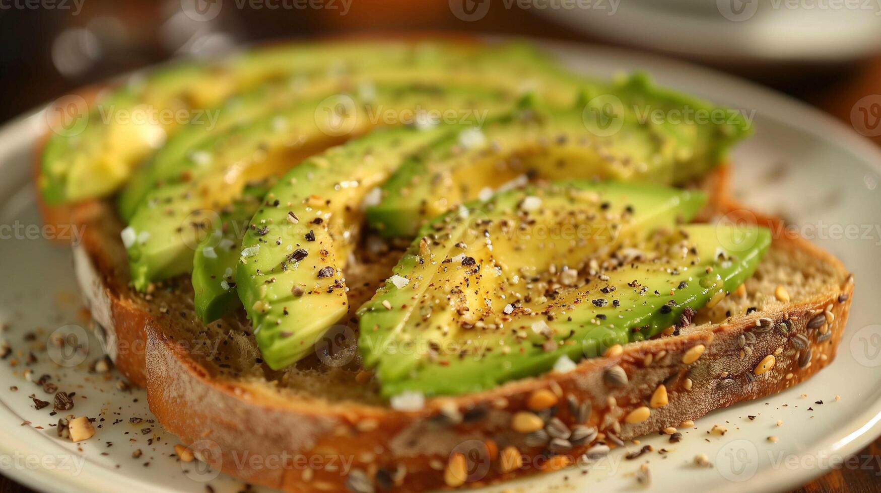 Simple avocado toast on whole grain bread with salt and pepper, picture photo