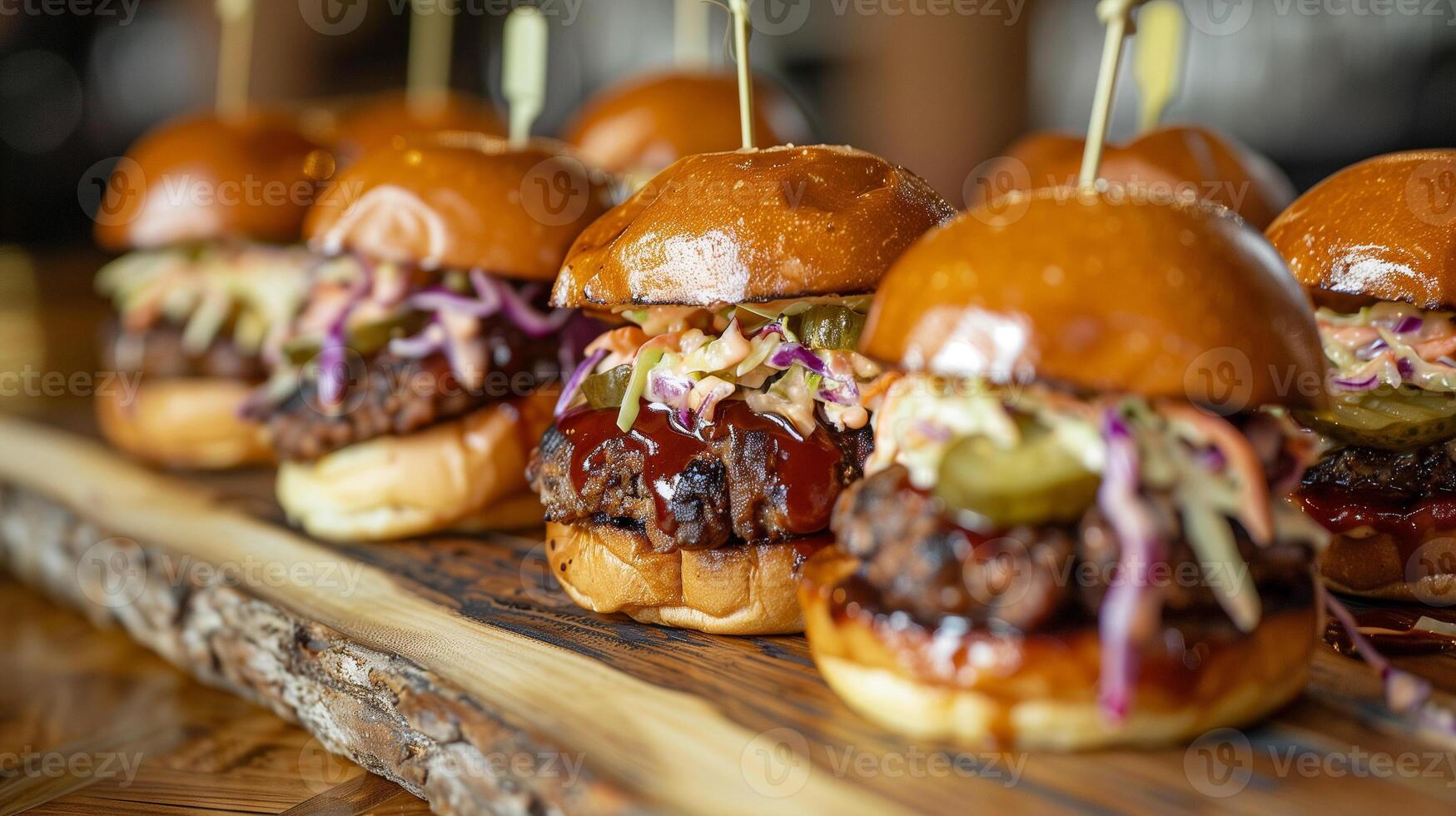 BBQ pork sliders topped with coleslaw and pickles lined up neatly on a rustic serving board, photo