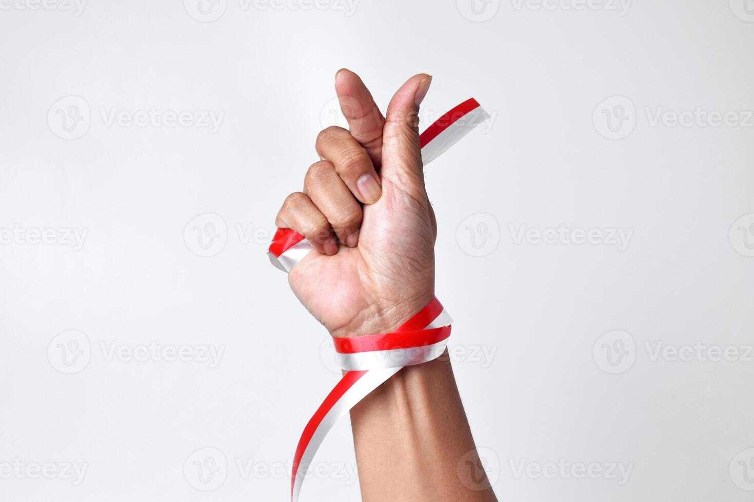 Greetings of love with two fingers circled by a red and white ribbon photo