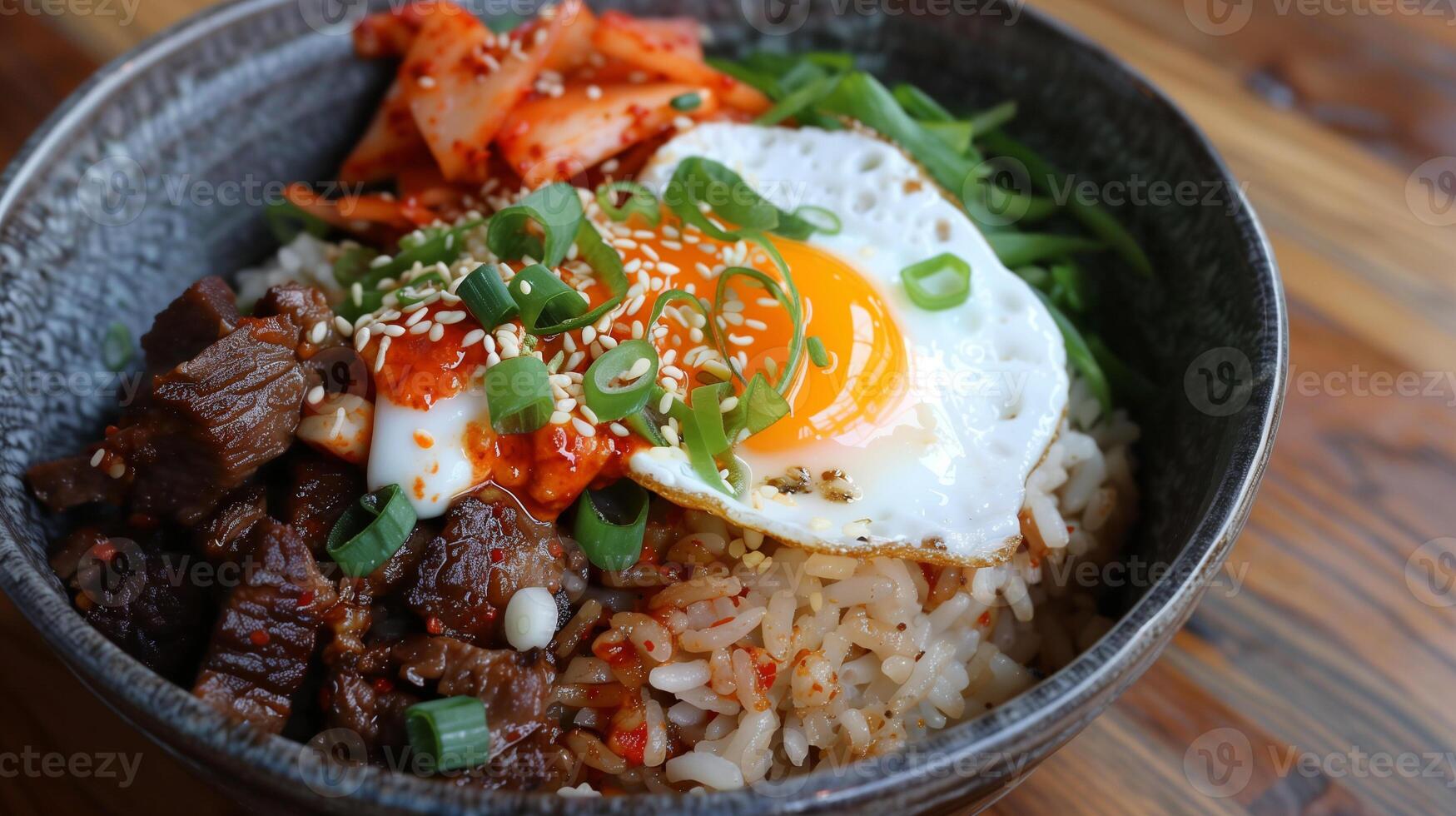 Korean-Mexican fusion bowl with brown rice spicy kimchi bulgogi beef and a fried egg, photo