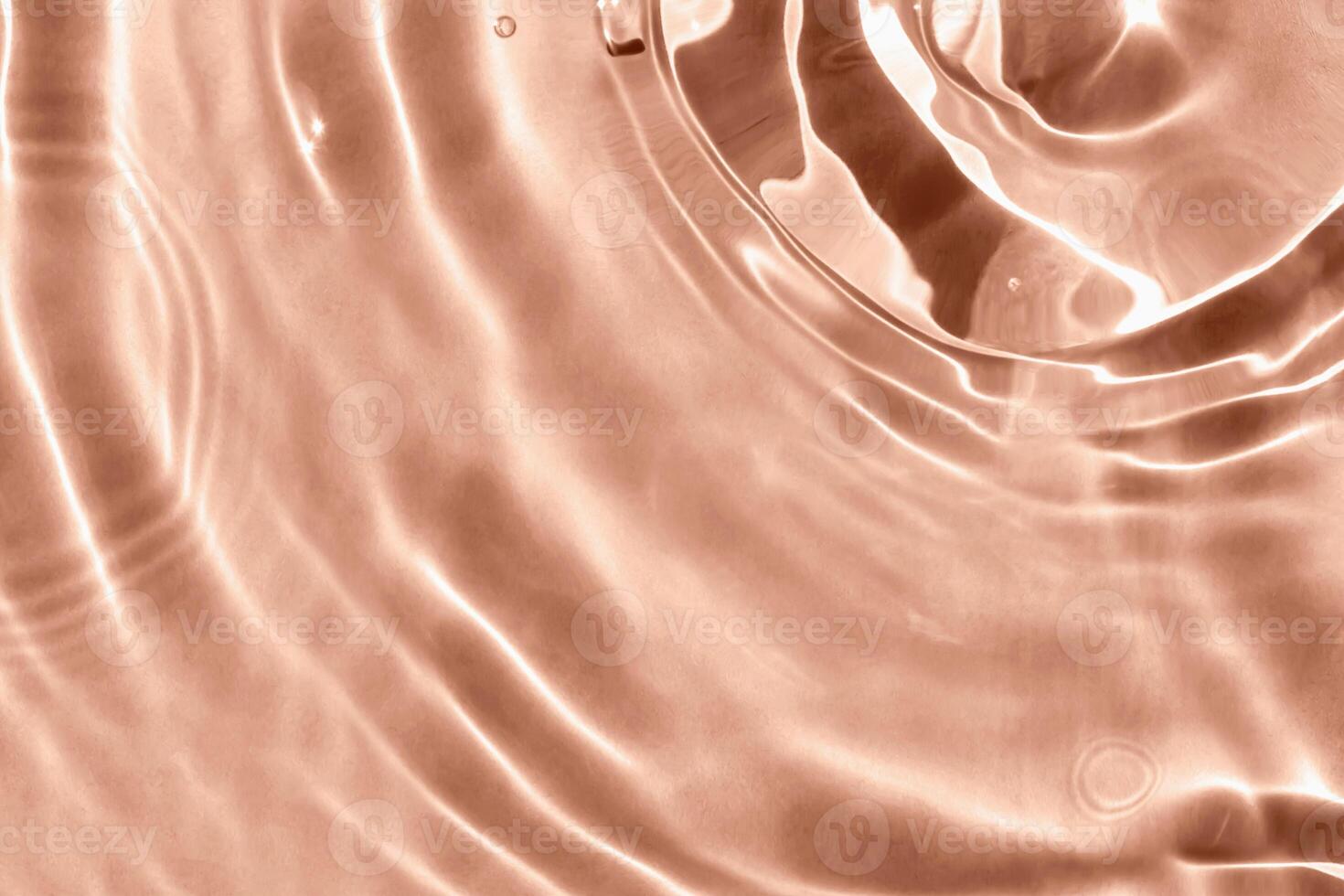 Textured background of waves on Mocha brown water with solar lightning. Concept of peace and relaxation. Close-up, selective focusing, defocusing. Demonstrating color of 2025 year photo