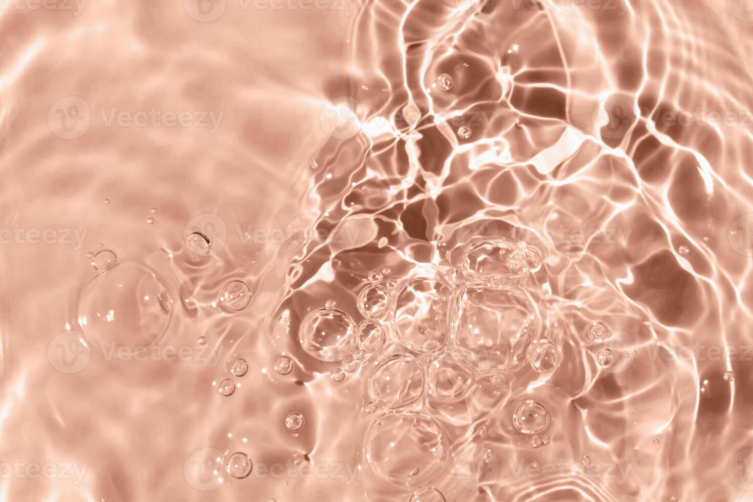 Sun glare, big bubbles on water. Mocha brown textured background. Close-up, selective focus, defocus. Demonstrating color of 2025 year photo