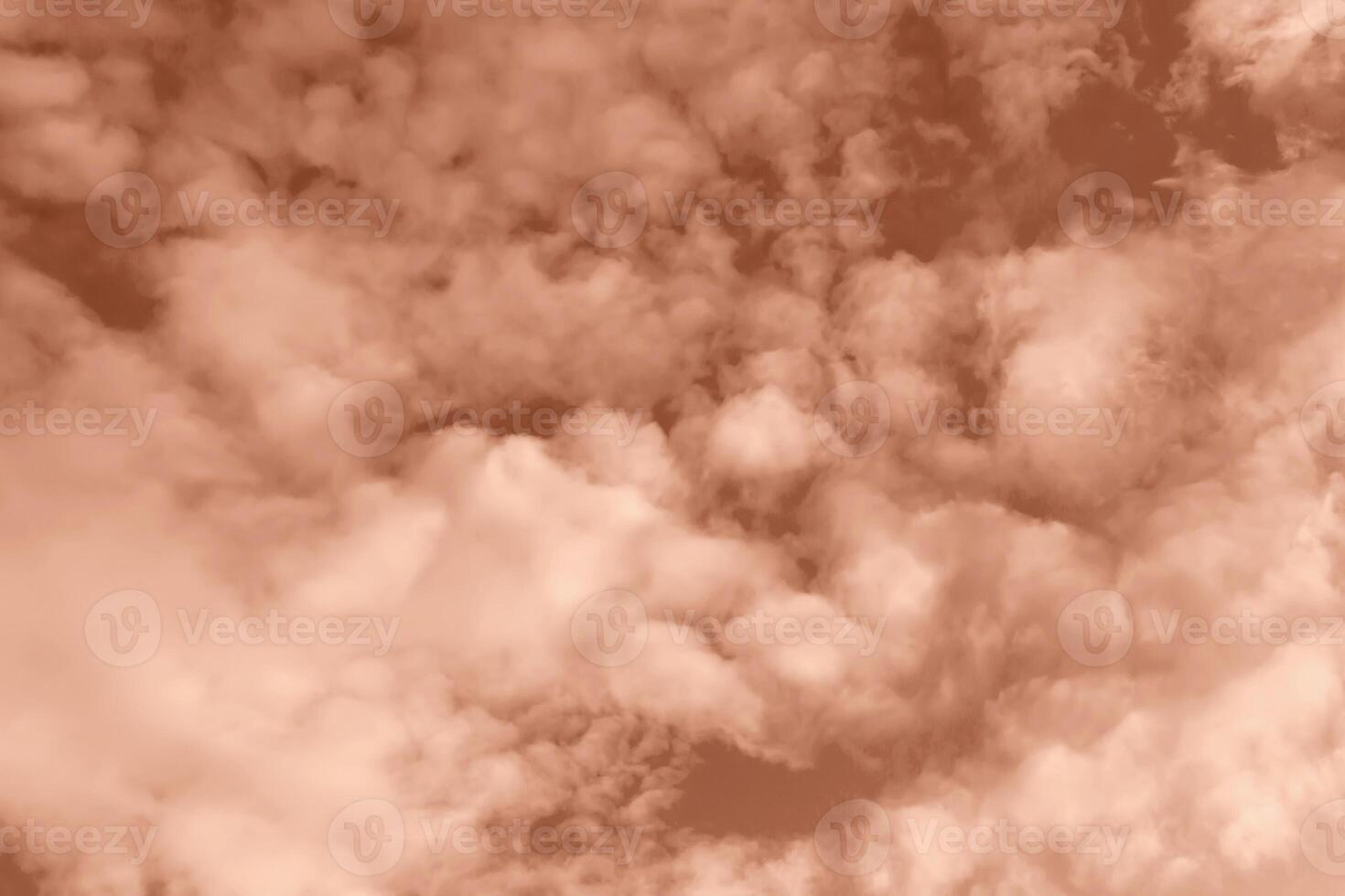 Fluffy clouds on Mocha brown sky photo