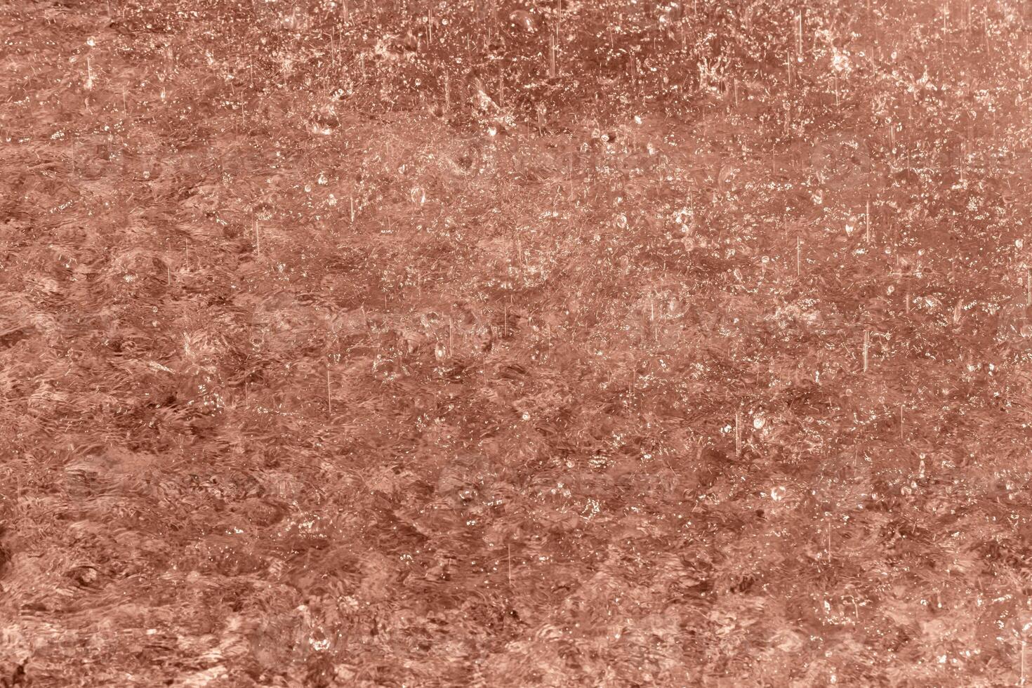 Rain splashing on water. Rainy Mocha brown background for design. Selective focus, defocus. Demonstrating color of 2025 year photo