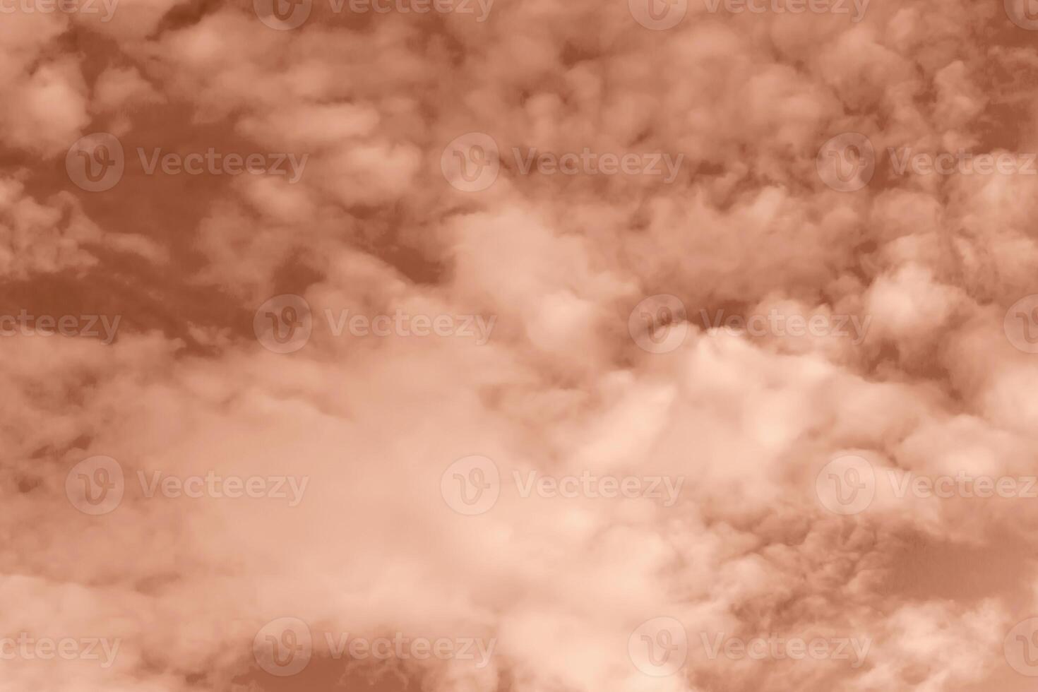 Fluffy curly clouds on sky. Textured Mocha brown background for design. Selective focus. Demonstrating color of 2025 year photo