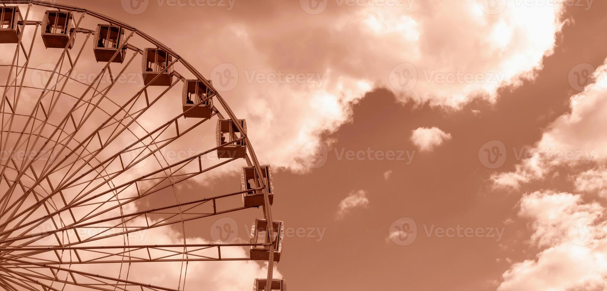 Ferris wheel against sky and clouds. Banner photo