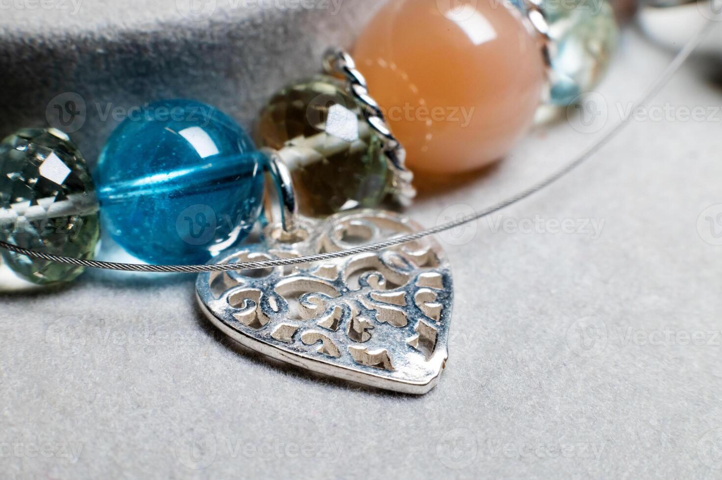 round polished natural stones assembled to create an exclusive health bracelet photo