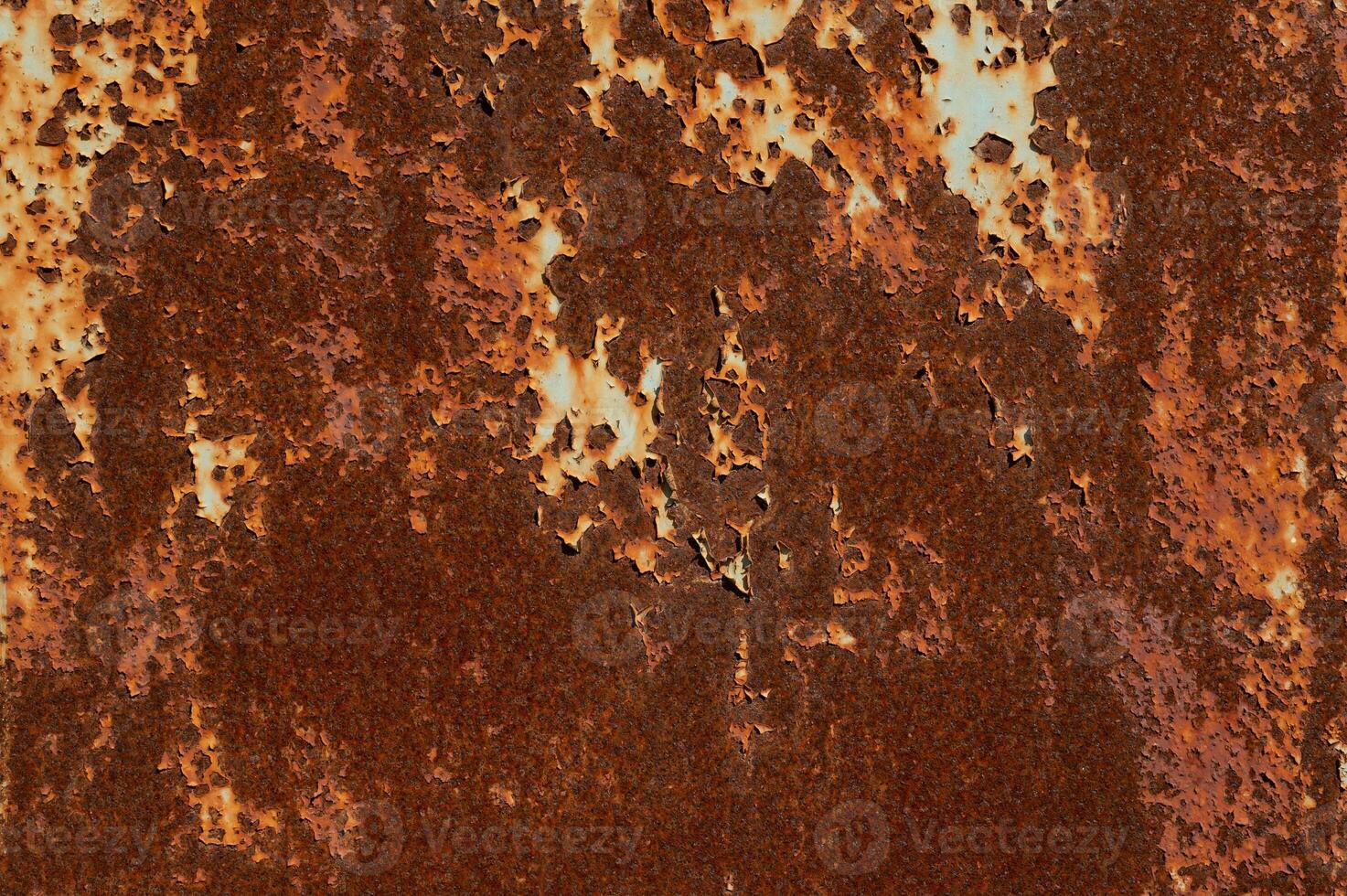 Texture of rusty metal surface with cracked peeling paint. Rusty background photo