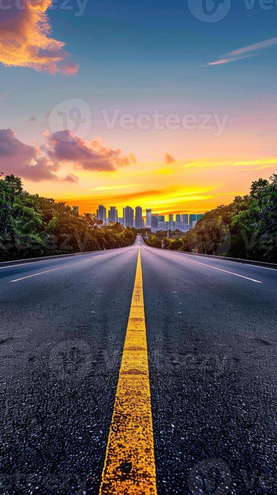 A long empty road with a yellow line on it photo