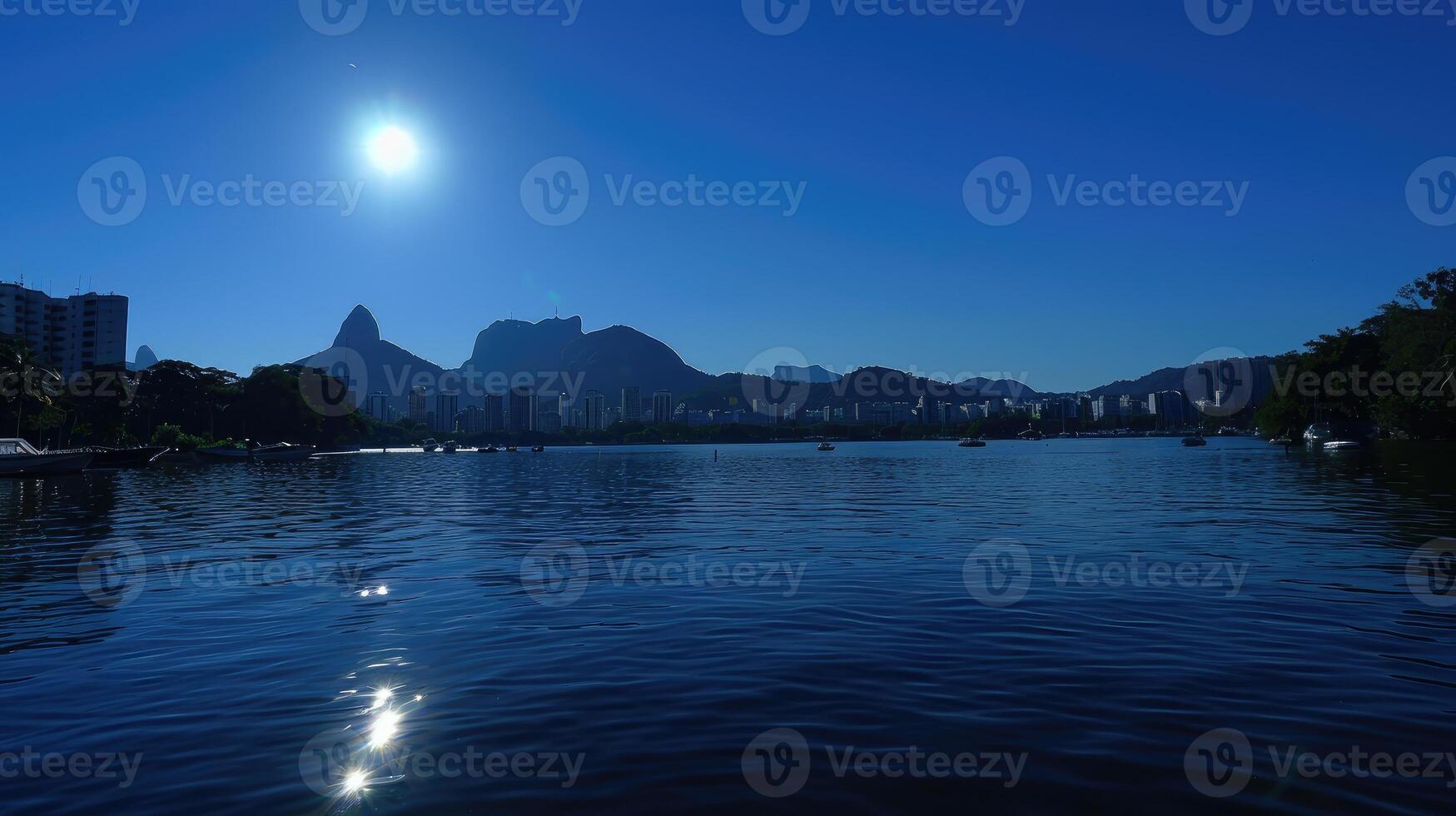 A large body of water with a mountain in the background photo