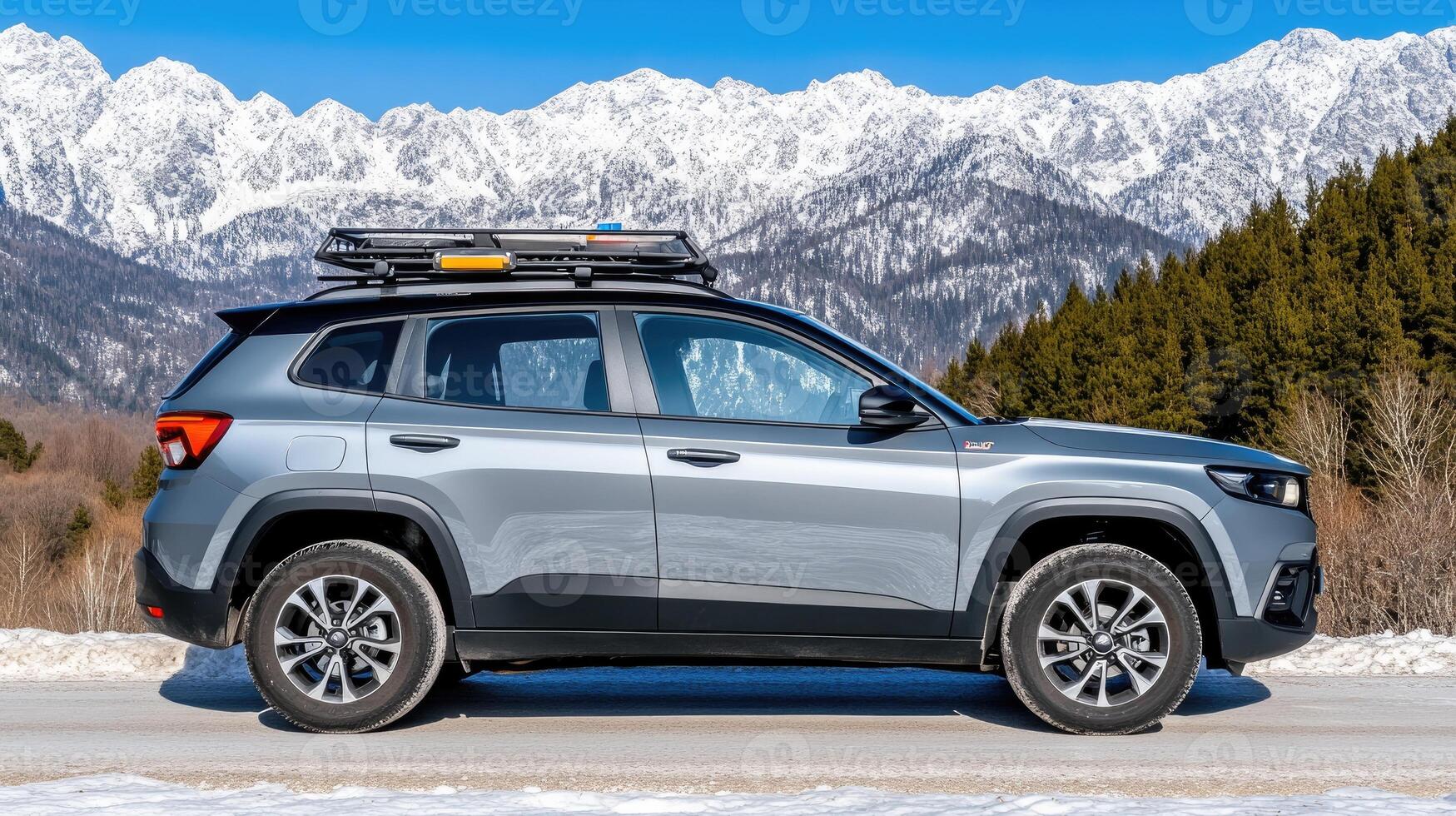 The 2020 jeep compass is parked on the side of the road with snow covered mountains in the photo
