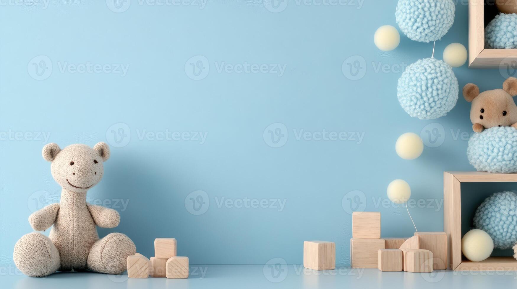 A teddy bear and wooden blocks on a blue wall photo