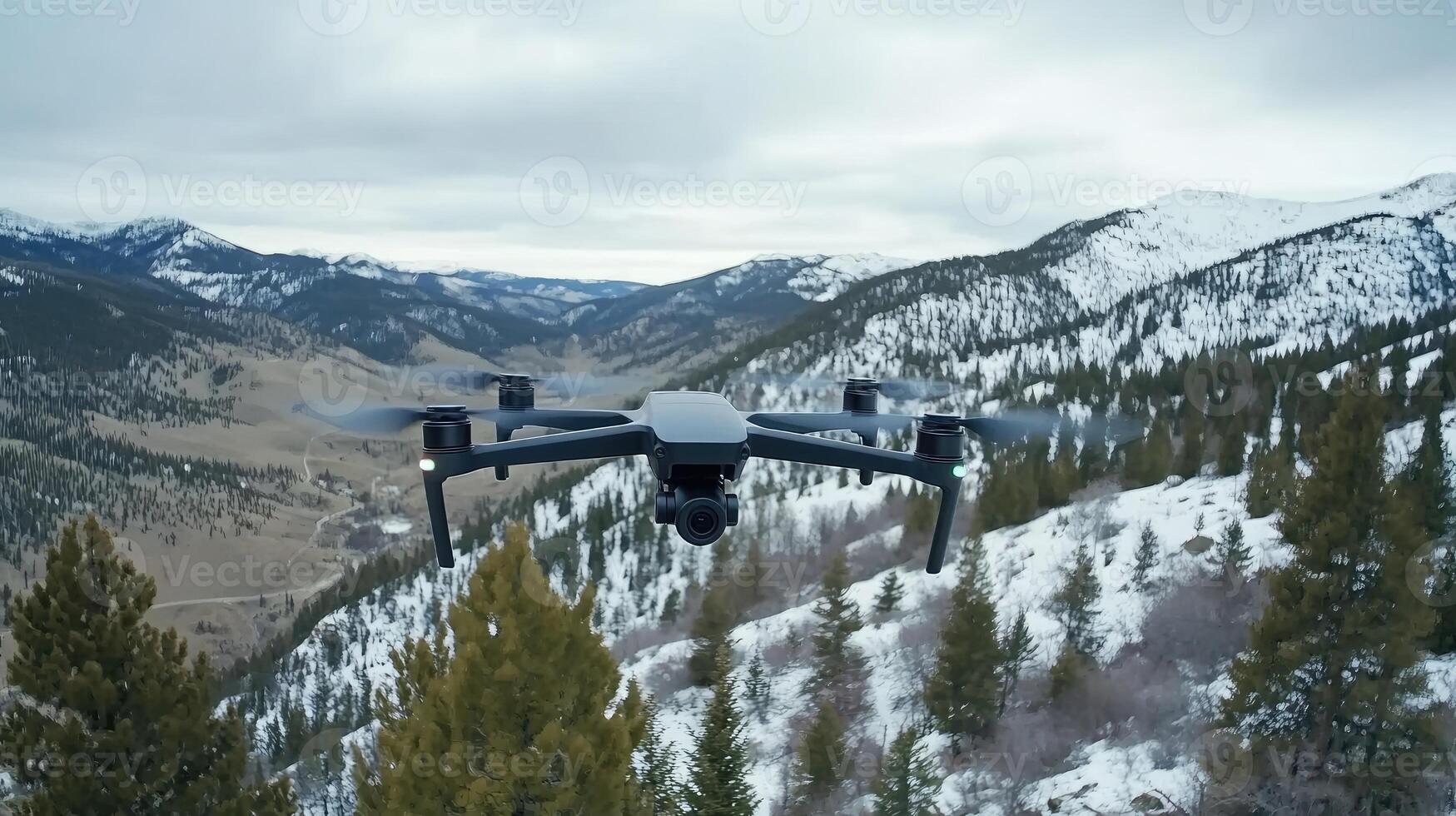 A drone flying over a snowy mountain range photo