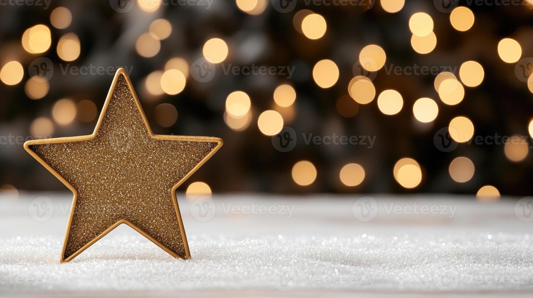 A golden star on a snowy background with blurred lights photo