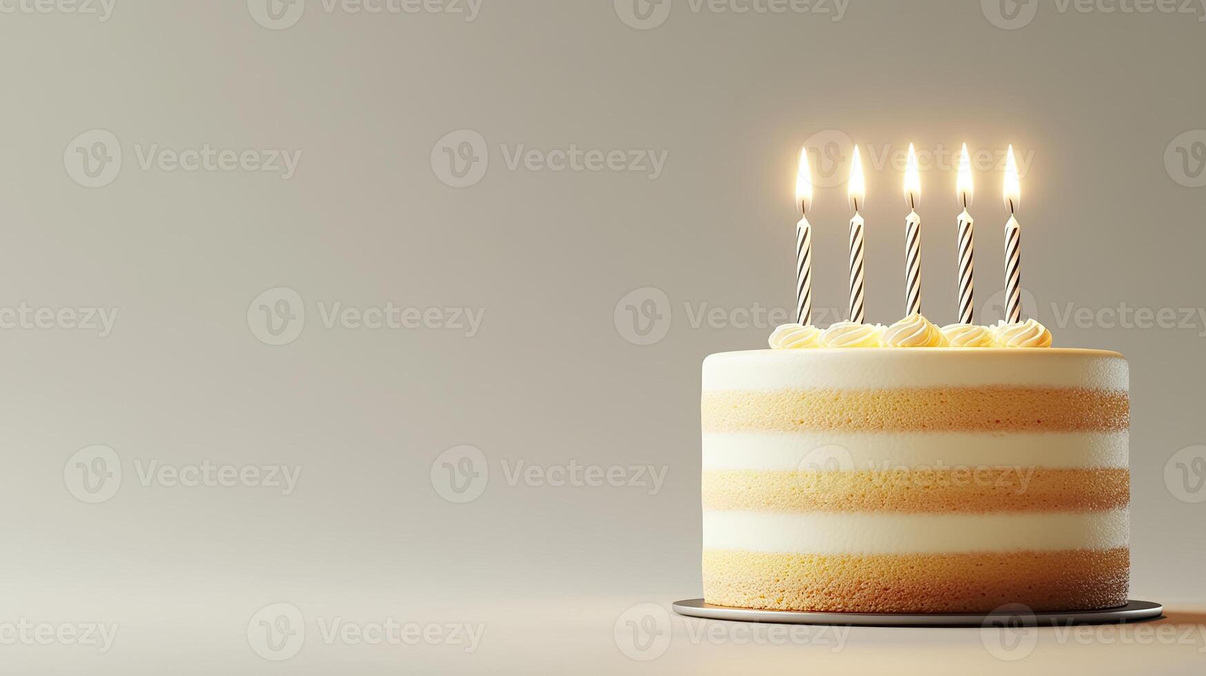 A cake with five lit candles on top photo