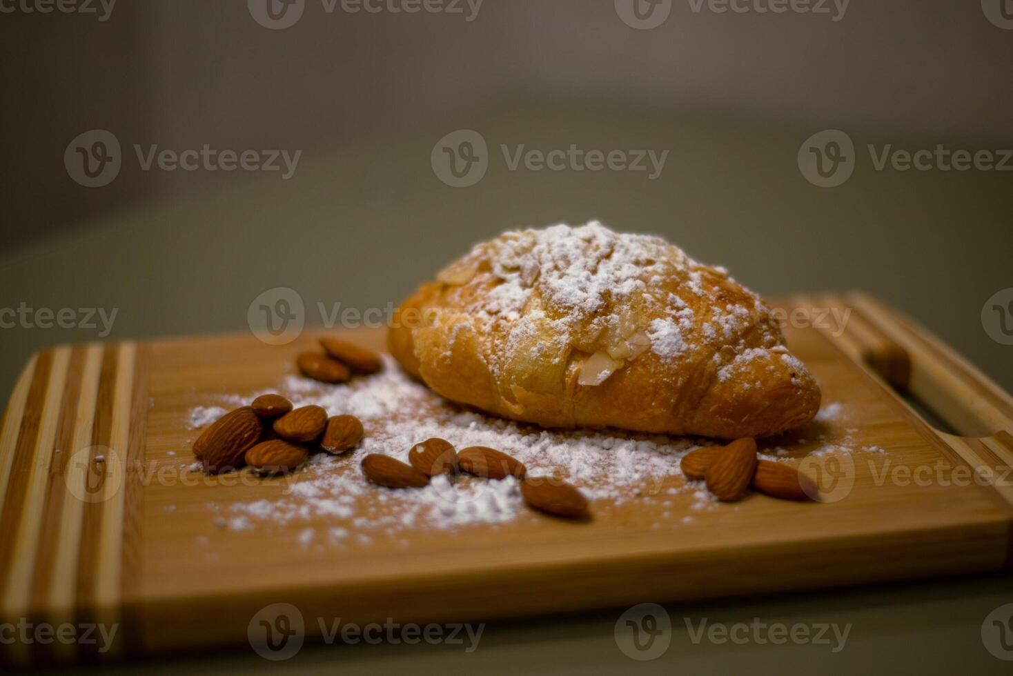 Almond croissant with powdered sugar photo