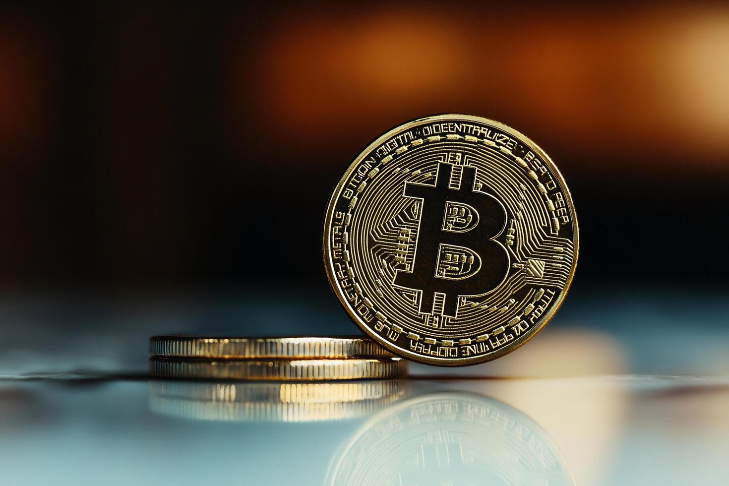Bitcoin and coins on a table photo