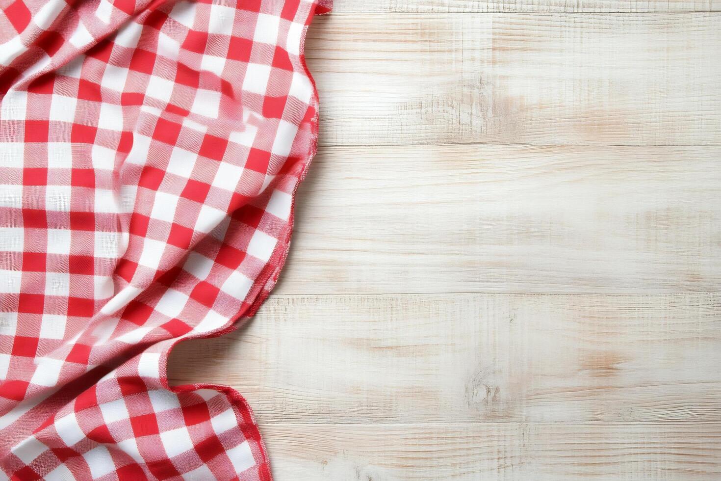 Checkered tablecloth on wooden table top view photo