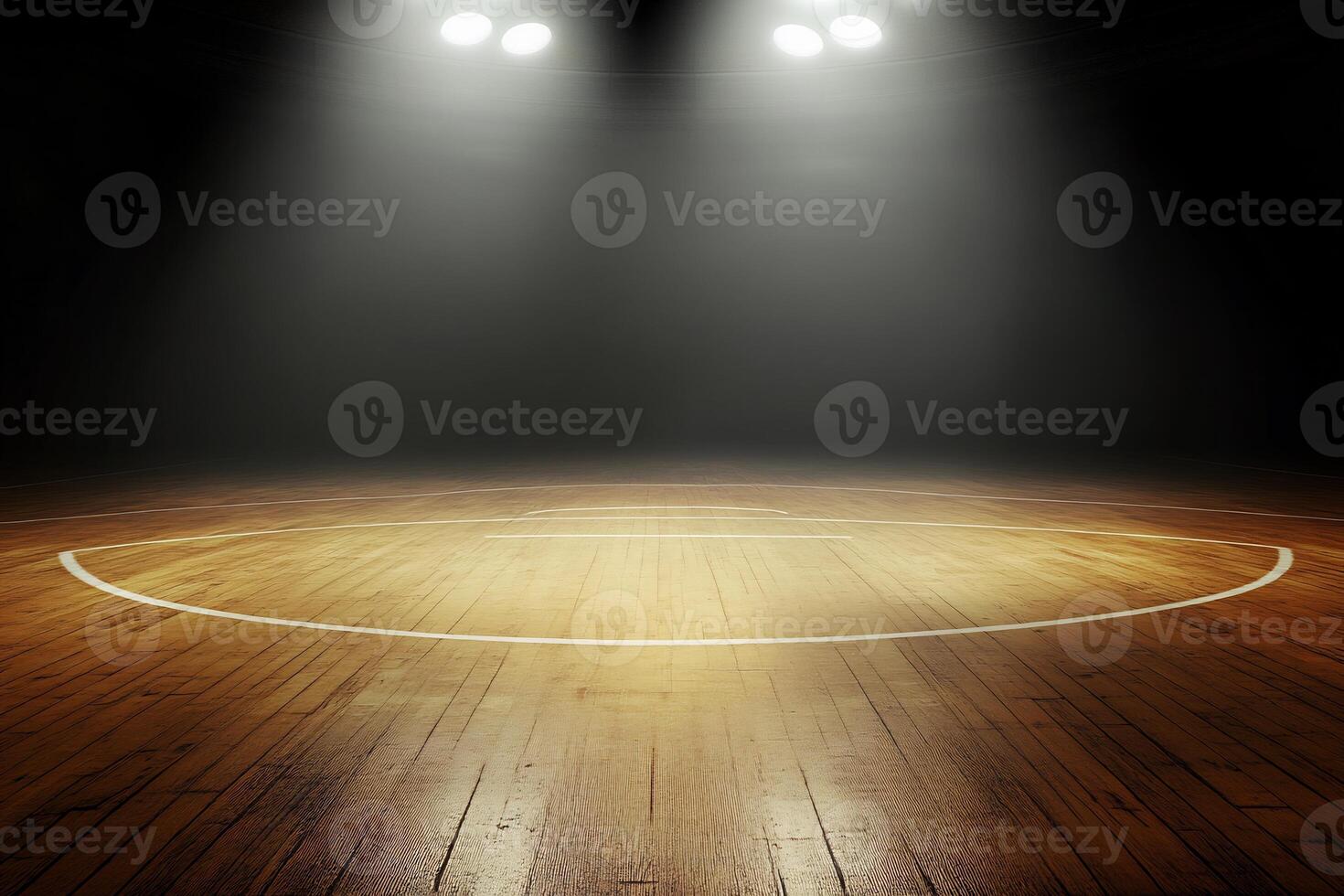 An empty basketball court with lights shining on it photo