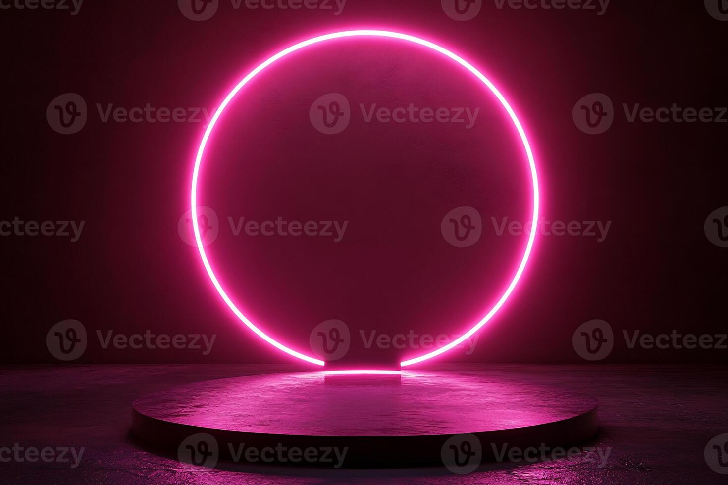 A pink neon circle on a pedestal in front of a dark background photo