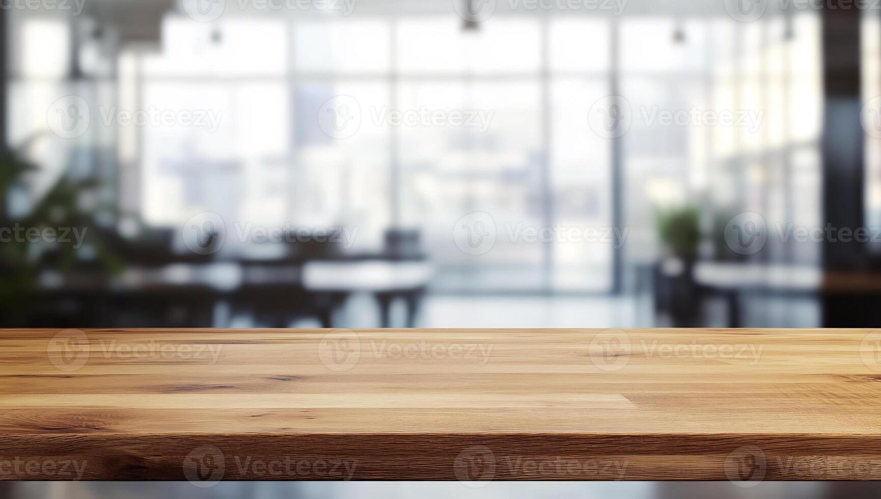 Empty wooden table top on a blurred office background photo