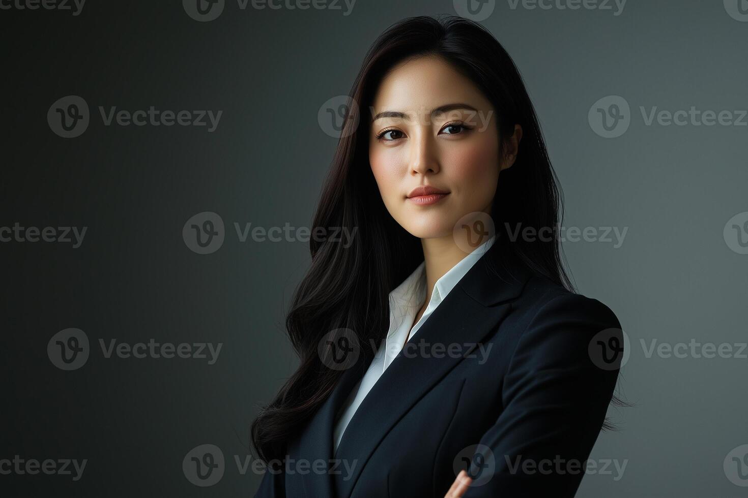 Asian business woman in suit and tie photo
