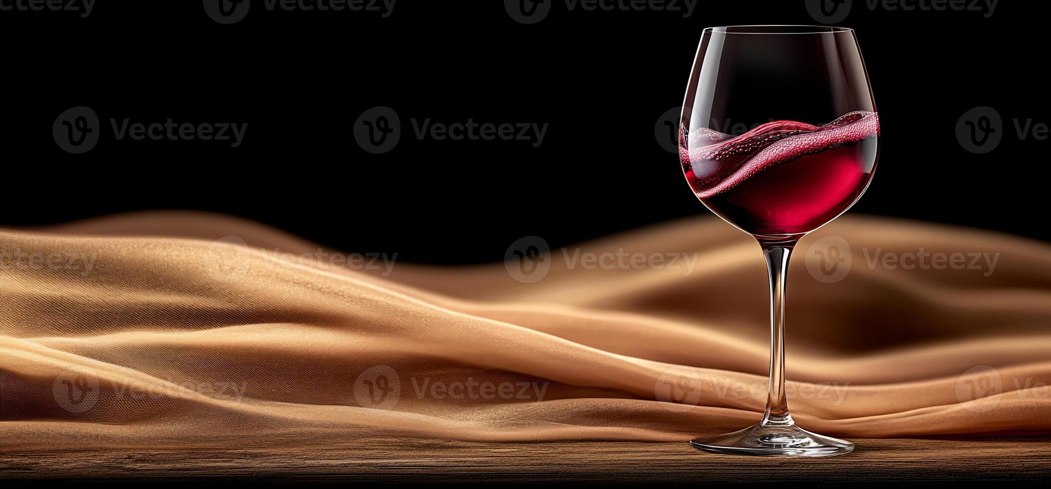 A glass of wine on a table photo