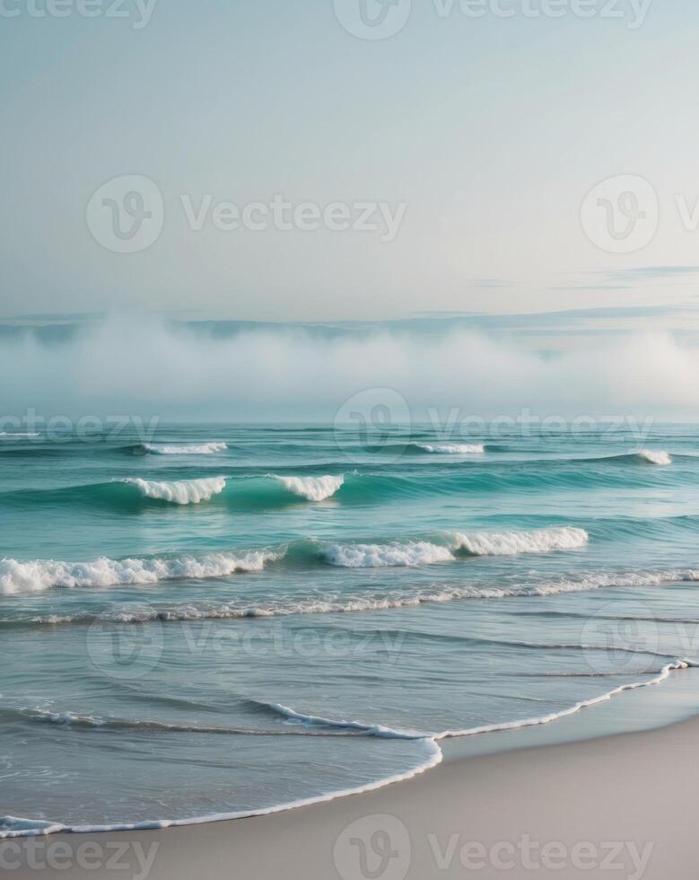 A beach with waves and fog in the distance photo