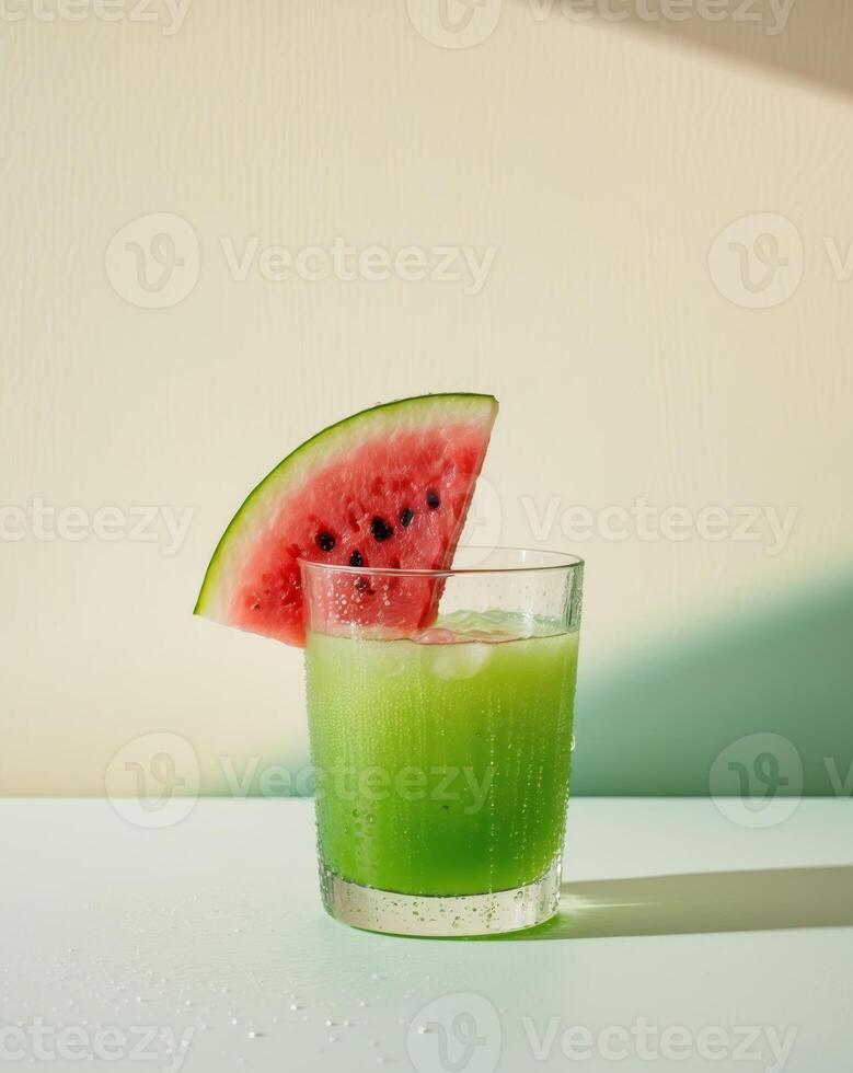 Refreshing summer drink with a slice of juicy watermelon on top photo