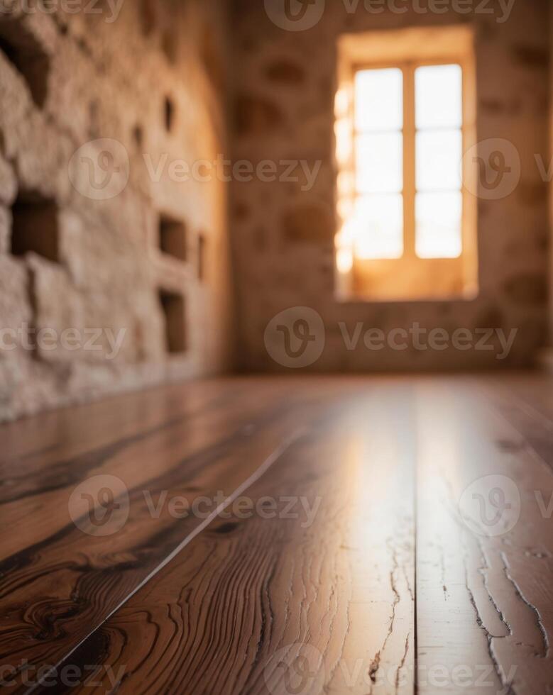 A wooden floor in an old building with a window photo