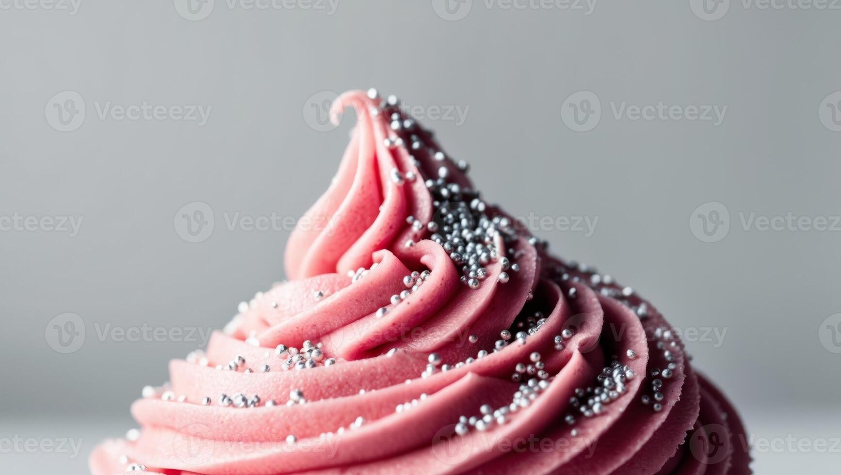 Closeup of Pink Frosting with Silver Sprinkles photo