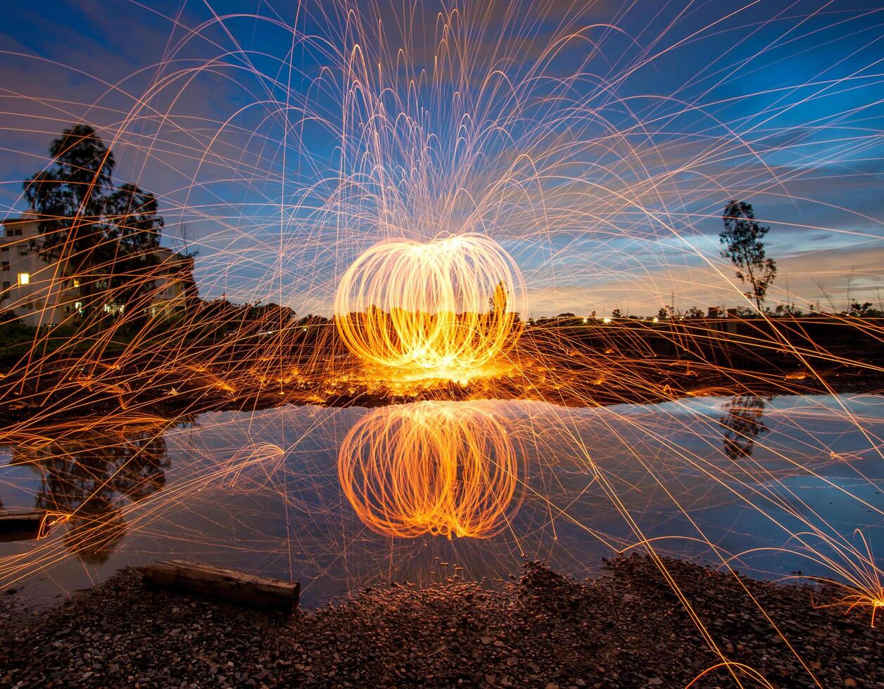 A firework is lit up by the light of the sun photo