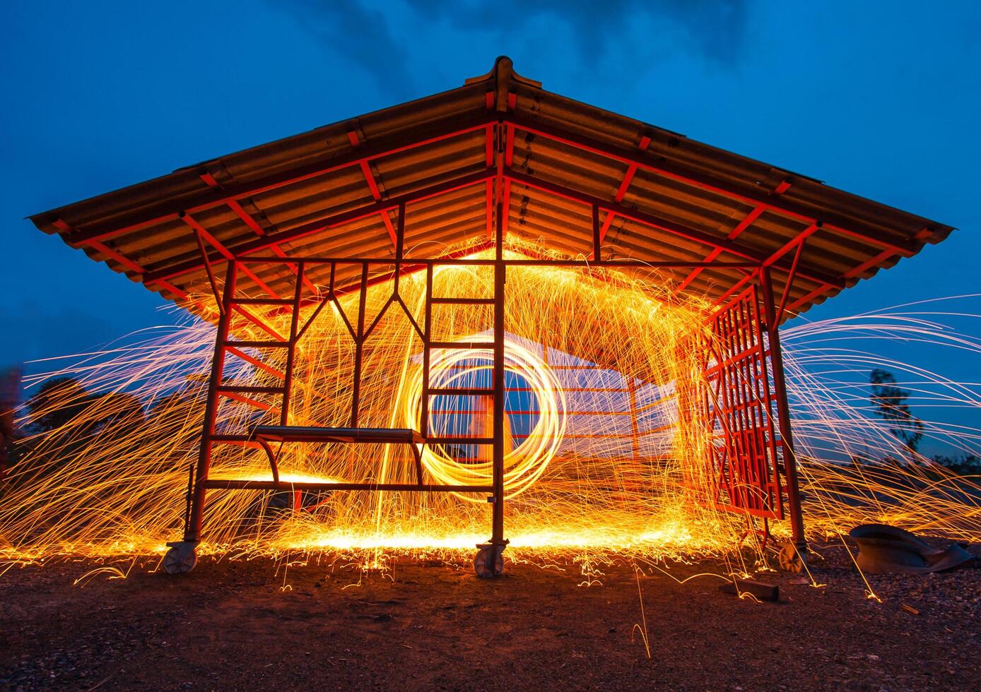 A building with a long exposure of a firework photo