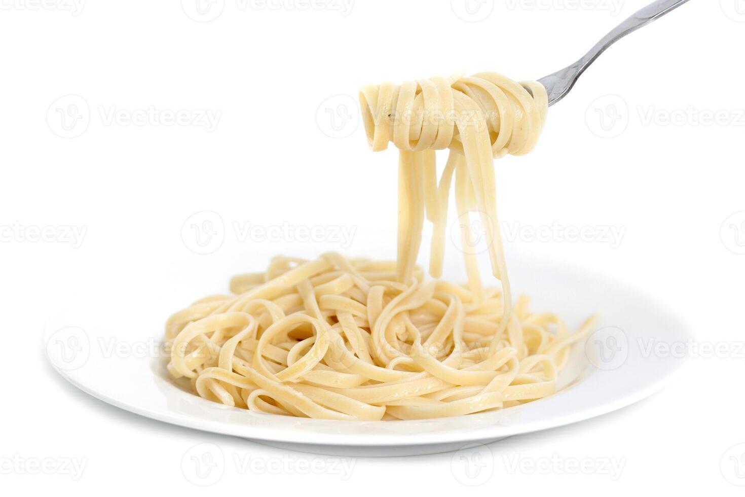 A fork is holding a spoonful of spaghetti photo