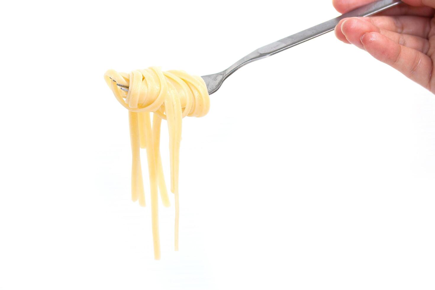 A person holding a fork with spaghetti on it photo