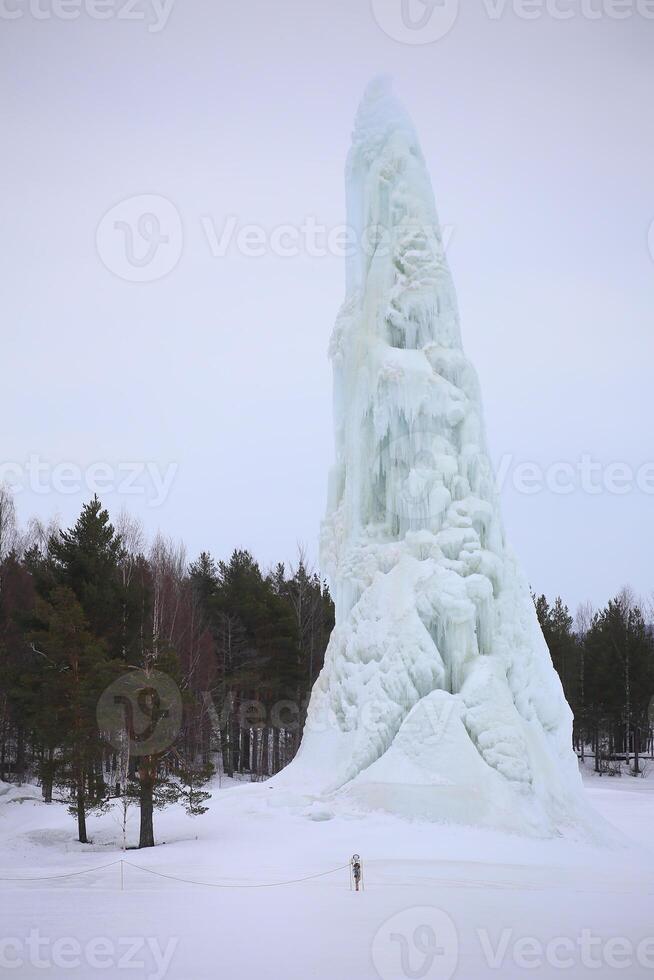 Ice tower formed by a fountain in Lycksele, northern Sweden photo
