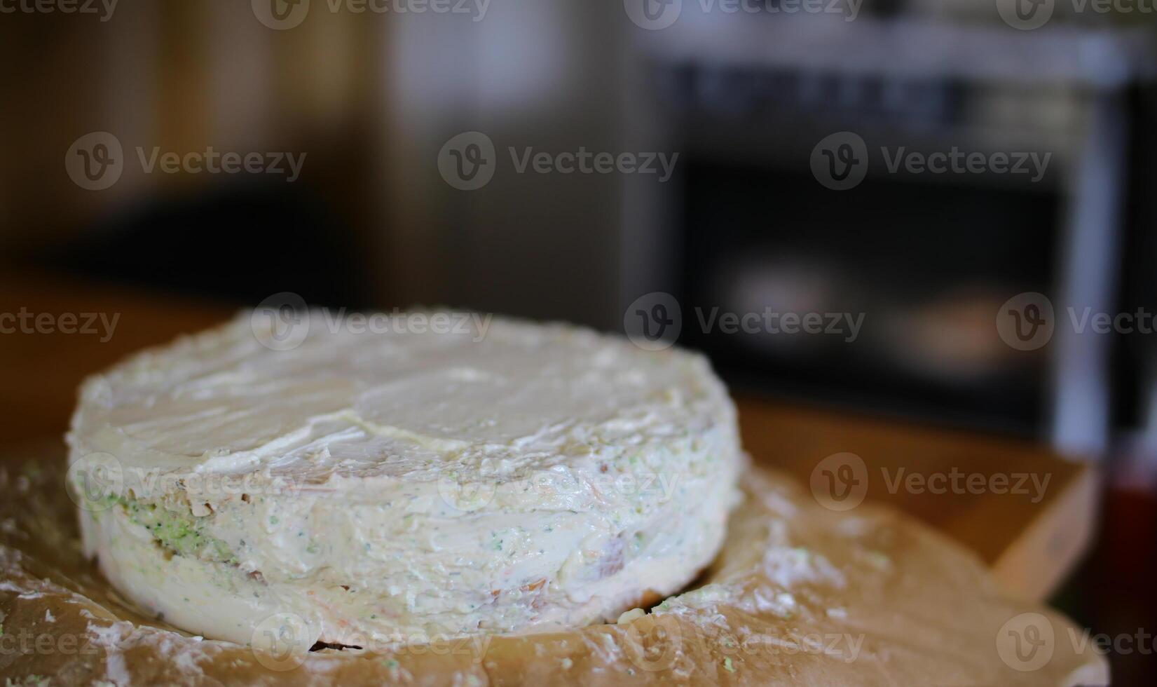 Preparation of Smorgastarta, a typical Swedish dish, in front of blurred kitchen stove photo