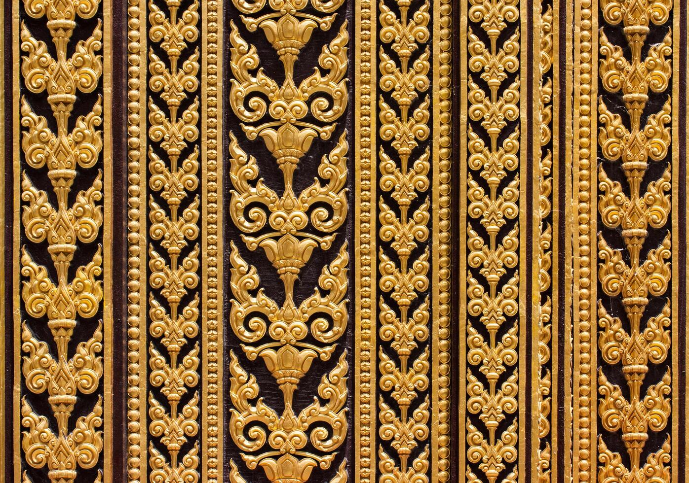 Golden decorative pattern on the wall of a building photo