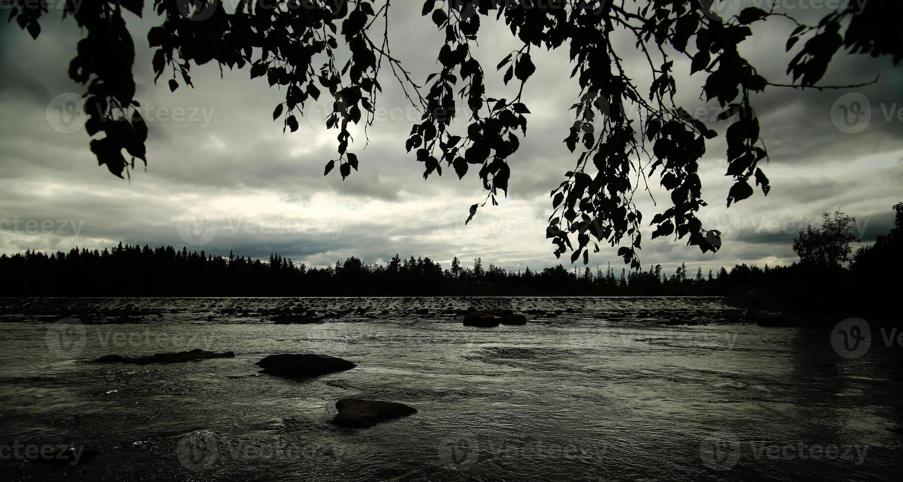 Black and white image of view over Angerman stream in Vilhelmina, Sweden photo