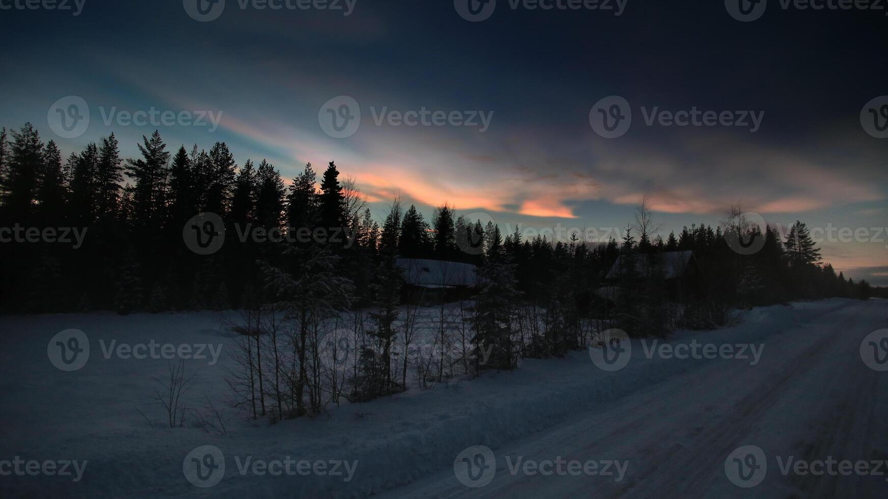 HDR image of nacreous clouds over Swedish farm buildings in winter photo