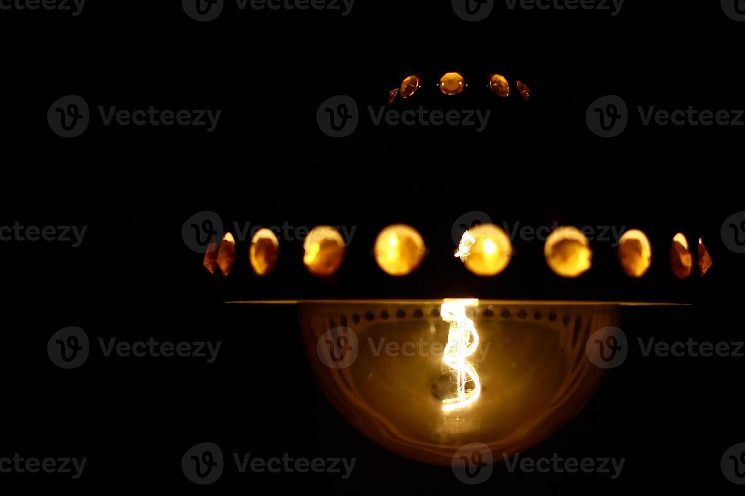 LED filament globe resembling an old carbon filament light bulb photo