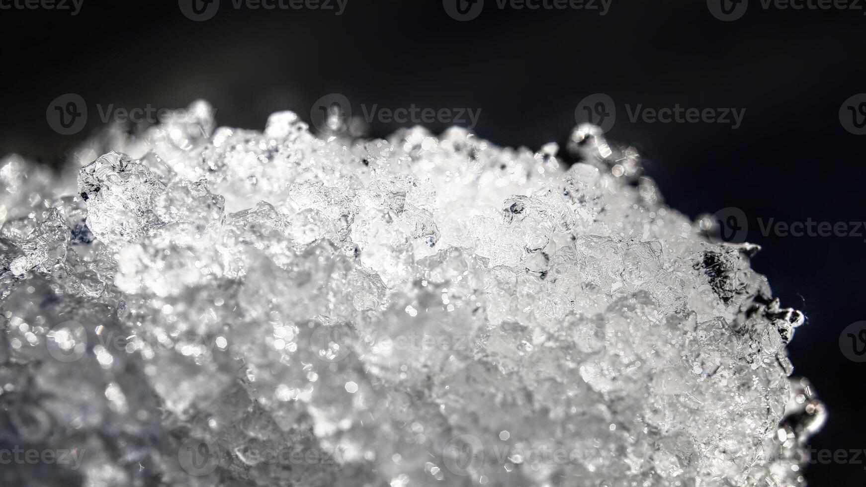 Close up of ice crystals in thawing snow photo
